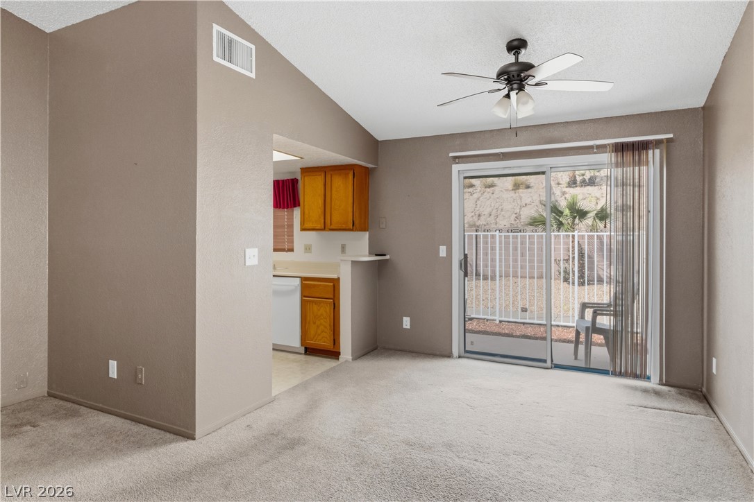 2124 Pebble Creek Lane Laughlin, NV 89029 - Photo 8 of 54 living room with light colored carpet and ceiling fan