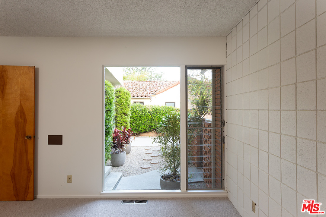 2116 Moreno Drive Los Angeles, CA 90039 - Photo 13 of 22 a view of a glass door and porch