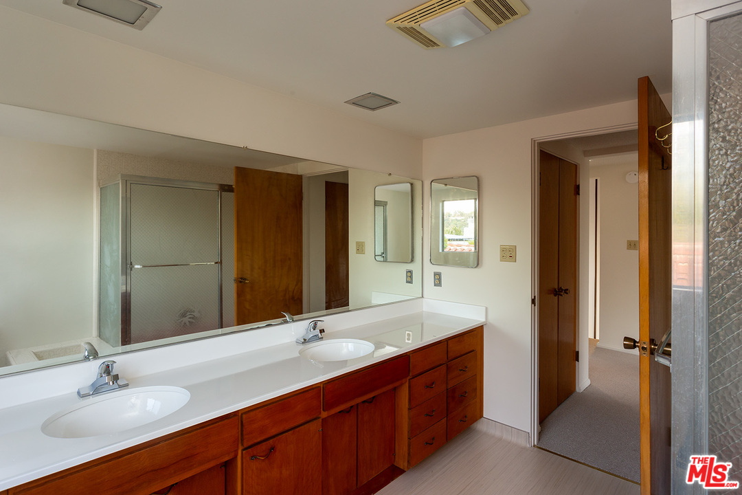 2116 Moreno Drive Los Angeles, CA 90039 - Photo 19 of 22 a bathroom with a double vanity sink and a mirror
