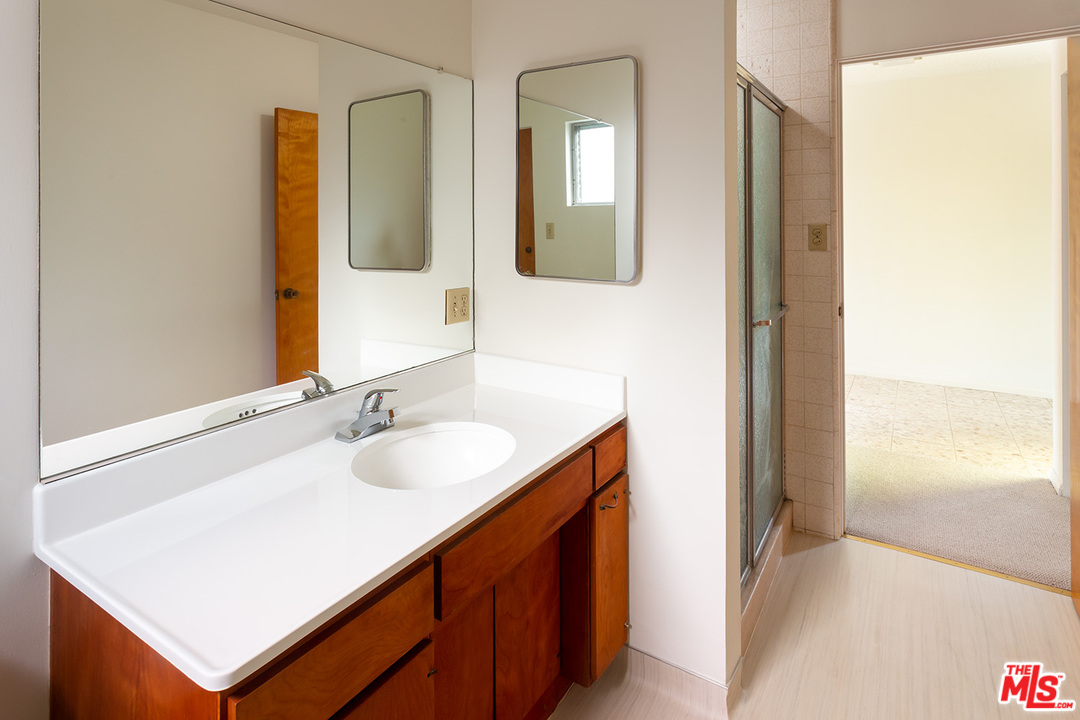 2116 Moreno Drive Los Angeles, CA 90039 - Photo 20 of 22 a bathroom with a sink and a mirror