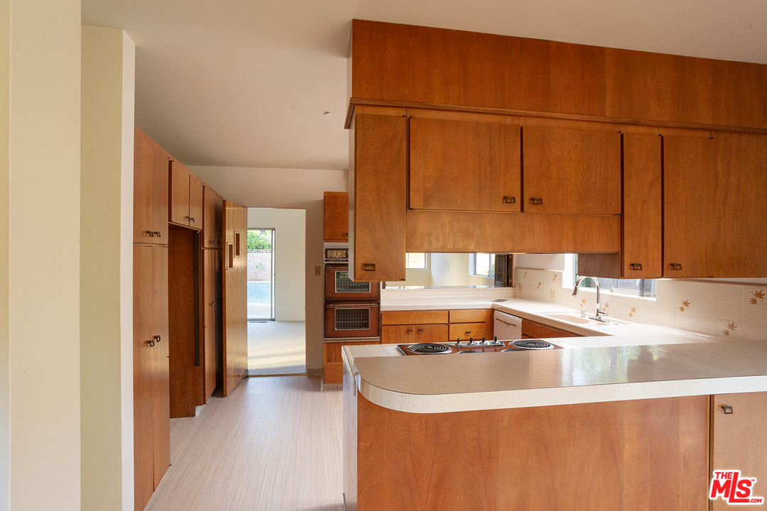 2116 Moreno Drive Los Angeles, CA 90039 - Photo 10 of 22 a kitchen with a sink and a refrigerator