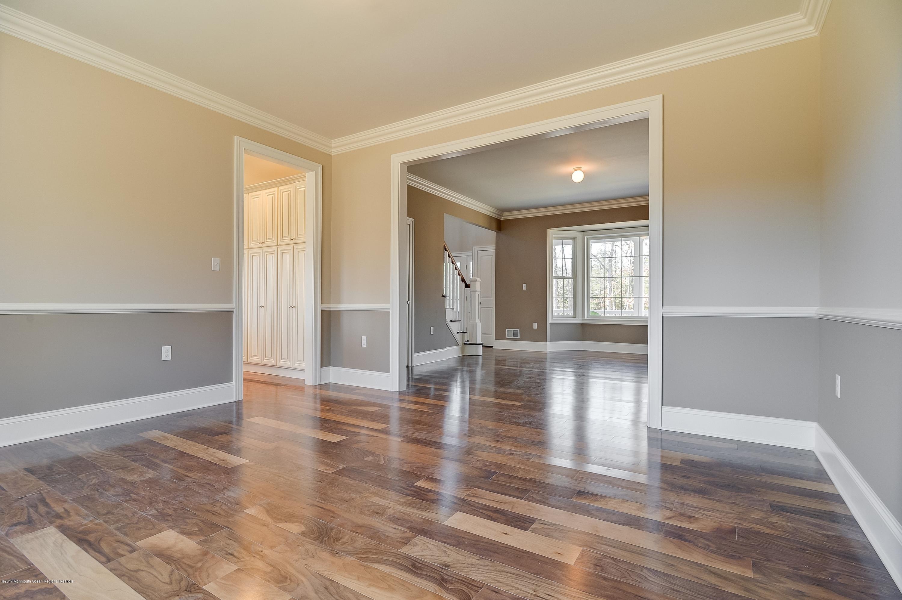 91 Obre Road Colts Neck, NJ 07722 - Photo 7 of 33 wooden floor in an empty room with a window