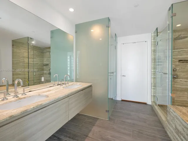 a bathroom with a bathtub and a shower