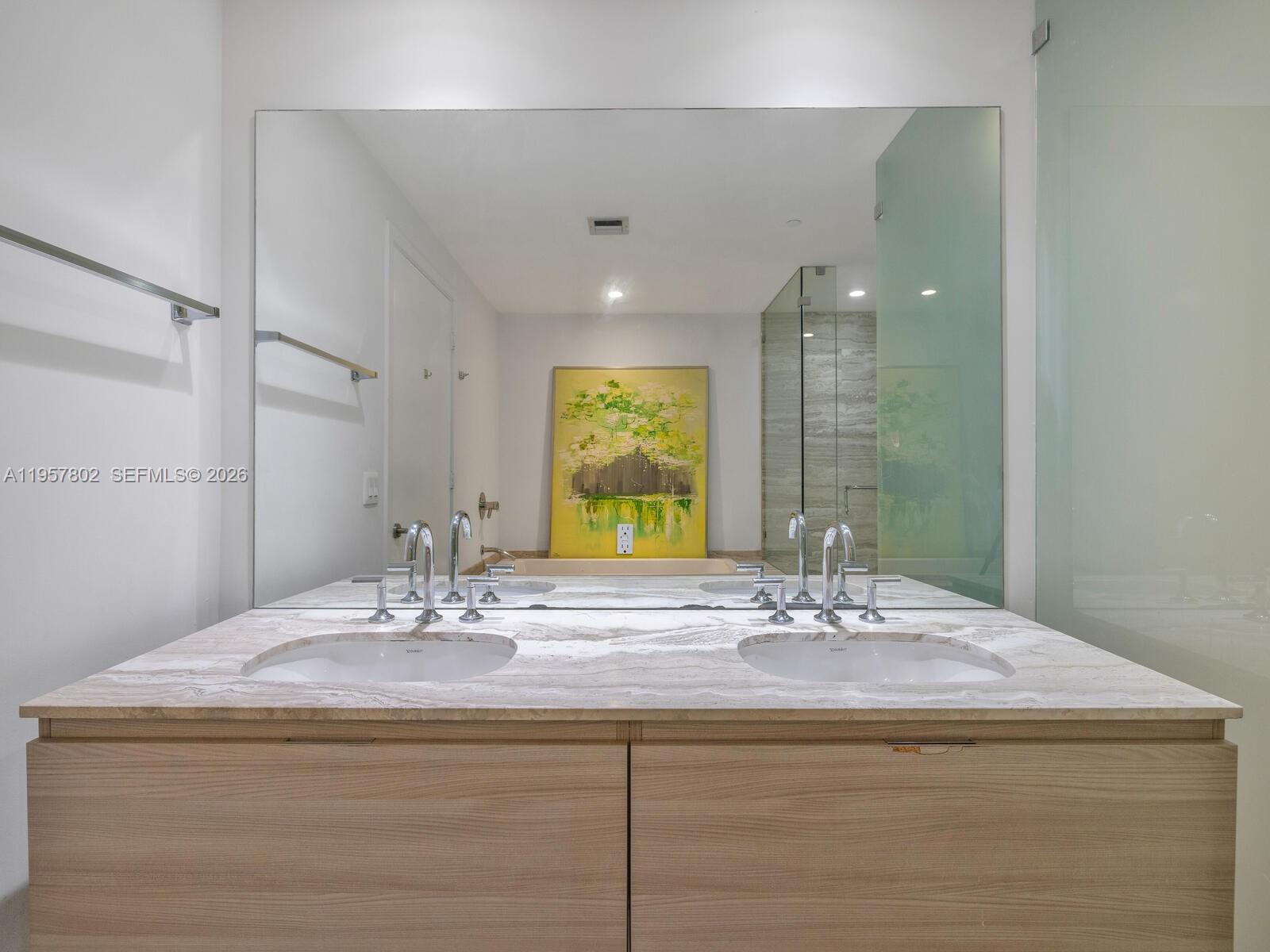 2900 Northeast 7th Avenue, Unit 3301 Miami, FL 33137 - Photo 16 of 55 a bathroom with a sink and a mirror