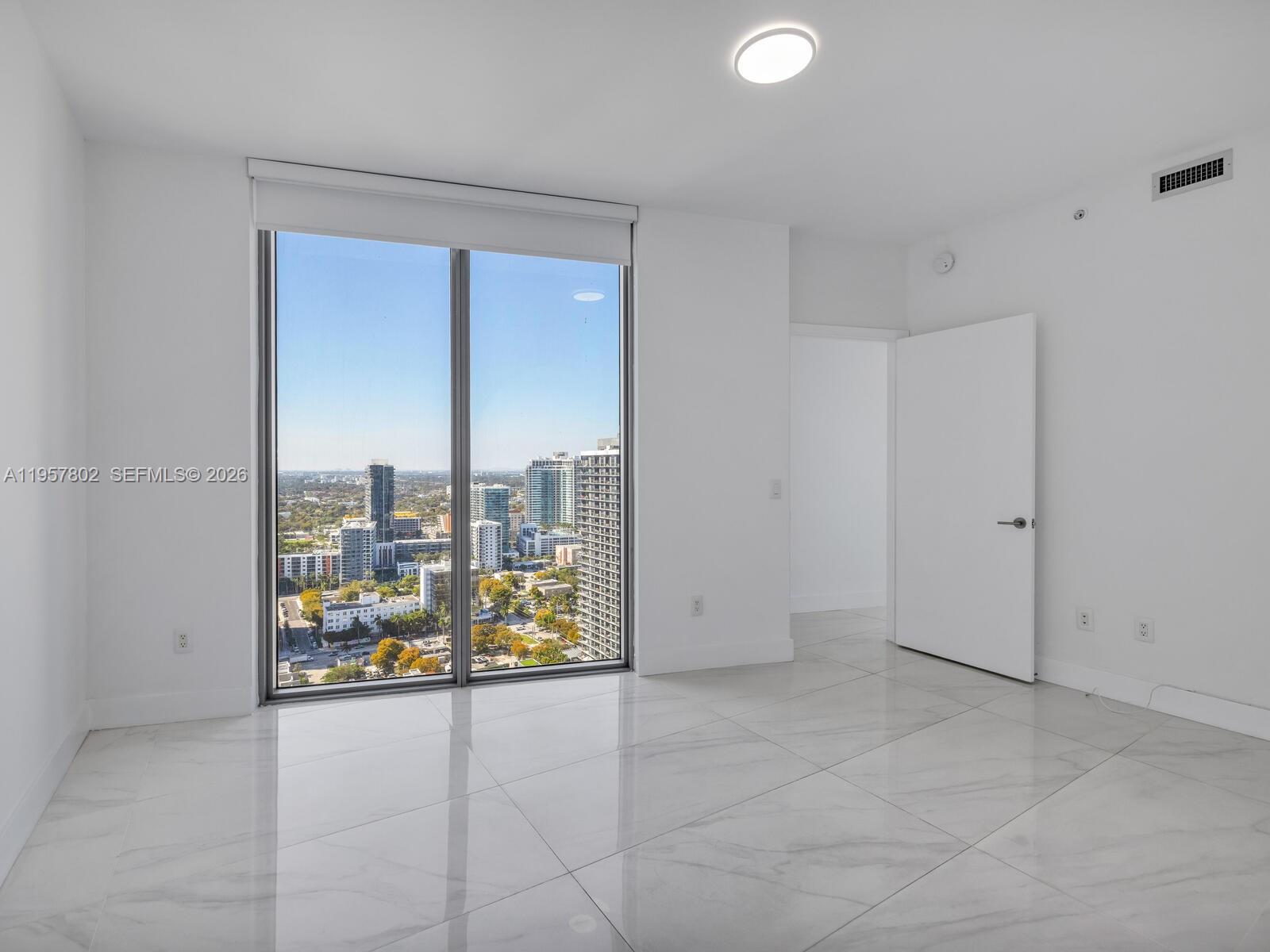 2900 Northeast 7th Avenue, Unit 3301 Miami, FL 33137 - Photo 22 of 55 a view of kitchen with refrigerator and window