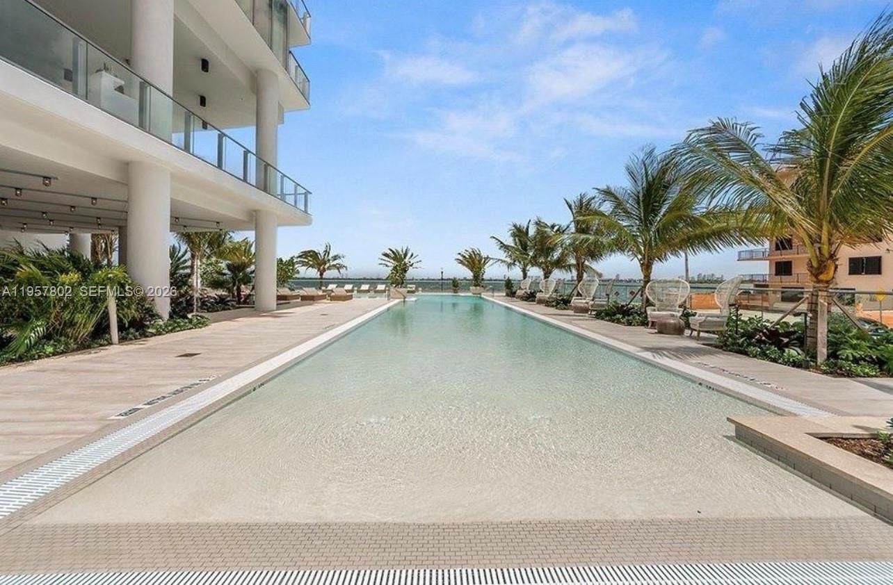 2900 Northeast 7th Avenue, Unit 3301 Miami, FL 33137 - Photo 44 of 55 a swimming pool with outdoor seating and yard