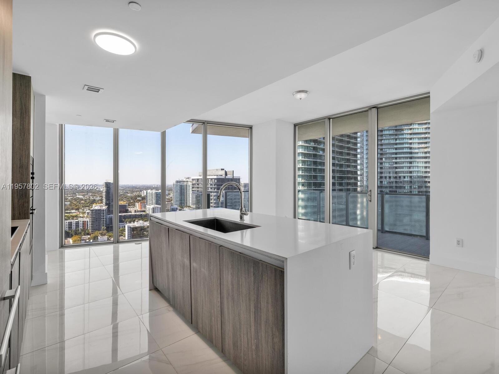 2900 Northeast 7th Avenue, Unit 3301 Miami, FL 33137 - Photo 6 of 55 a kitchen with a sink and large window