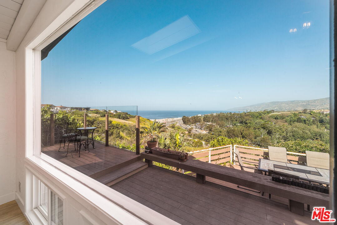 29500 Heathercliff Road, Unit 202 Malibu, CA 90265 - Photo 17 of 36 a view of a balcony with lake view and mountain view