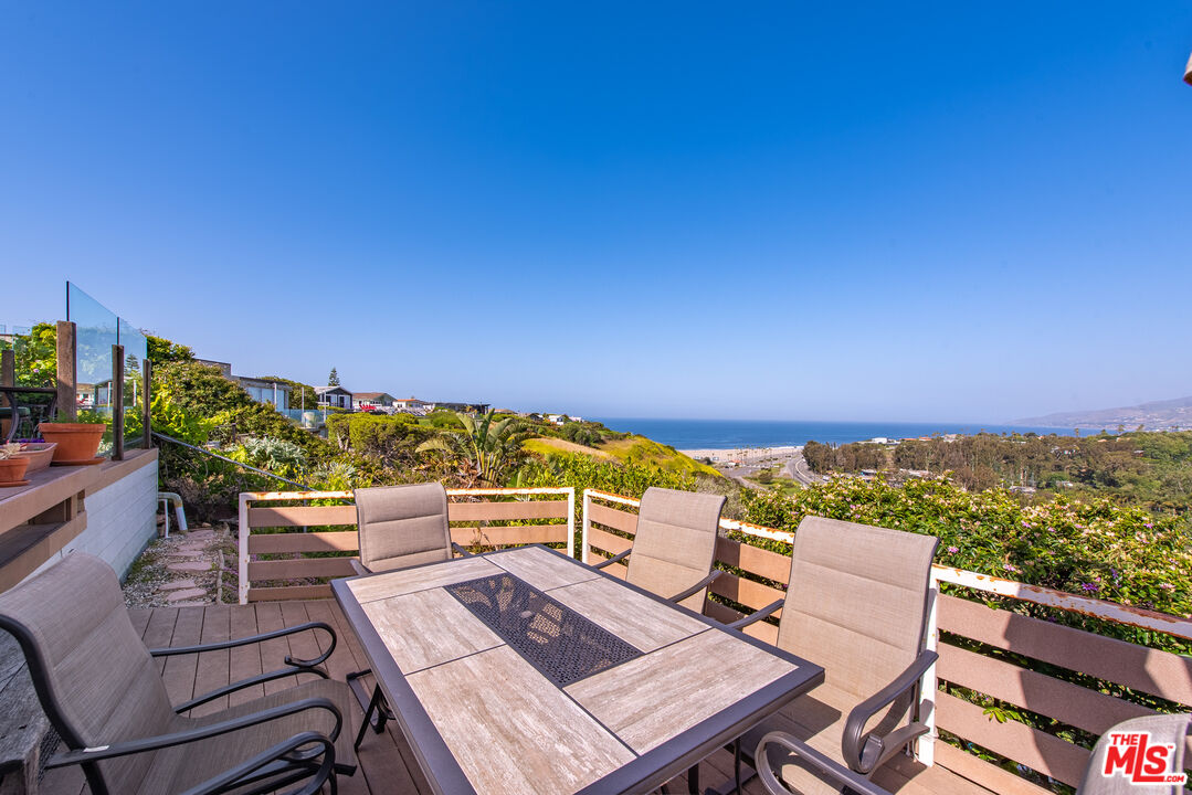 29500 Heathercliff Road, Unit 202 Malibu, CA 90265 - Photo 18 of 36 an outdoor sitting area with a couch
