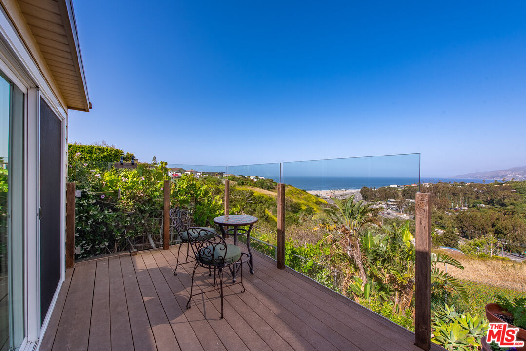 29500 Heathercliff Road, Unit 202 Malibu, CA 90265 - Photo 2 of 36 a view of a balcony with chairs