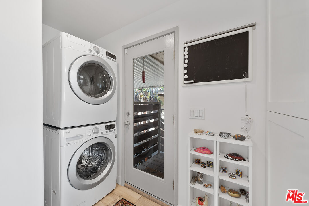29500 Heathercliff Road, Unit 202 Malibu, CA 90265 - Photo 27 of 36 a view of a livingroom with washer and dryer