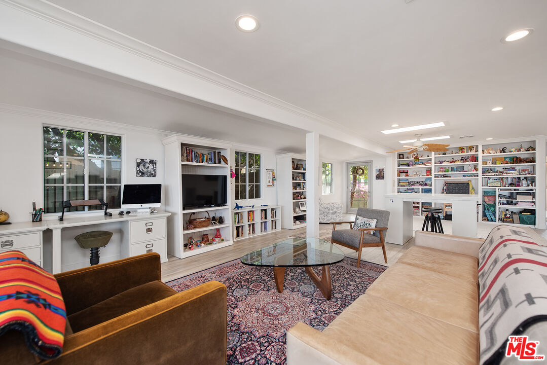 29500 Heathercliff Road, Unit 202 Malibu, CA 90265 - Photo 7 of 36 a living room with fireplace furniture and a flat screen tv