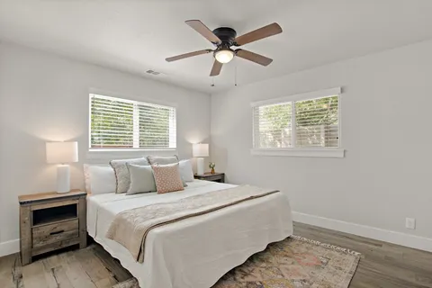 a bedroom with a bed and a window