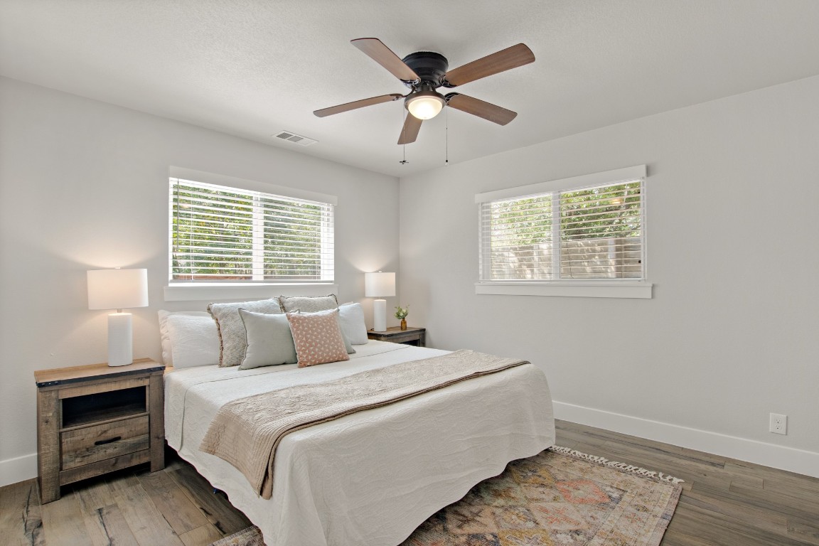 9110 Chisholm Lane Austin, TX 78748 - Photo 13 of 27 a bedroom with a bed and a window