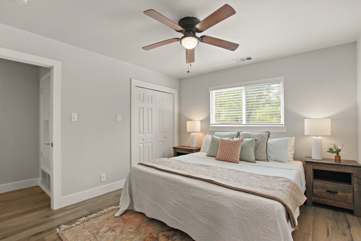 9110 Chisholm Lane Austin, TX 78748 - Photo 14 of 27 a bedroom with a large bed and a window