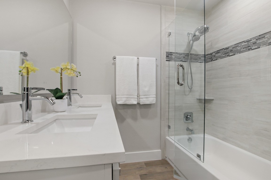 9110 Chisholm Lane Austin, TX 78748 - Photo 17 of 27 a bathroom with a sink and a shower