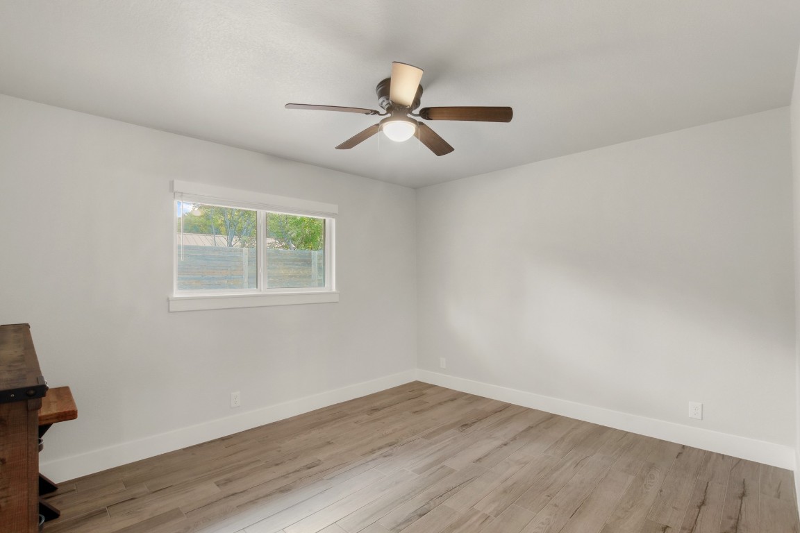9110 Chisholm Lane Austin, TX 78748 - Photo 20 of 27 a view of empty room with wooden floor and fan