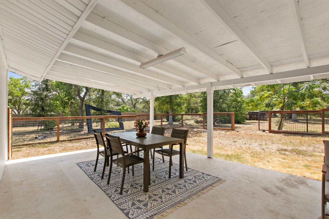 9110 Chisholm Lane Austin, TX 78748 - Photo 23 of 27 a view of a patio with a table chairs and backyard
