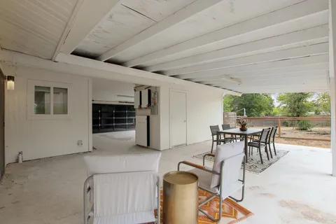 a view of a livingroom with furniture and garden