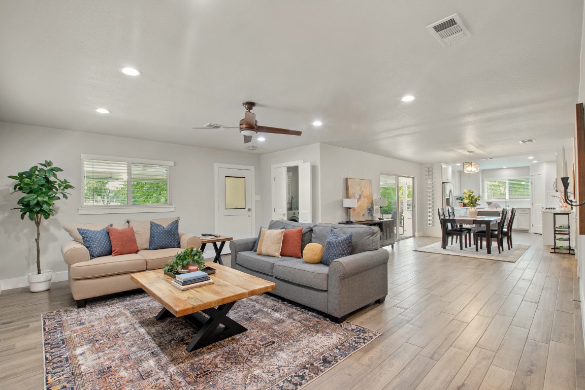 9110 Chisholm Lane Austin, TX 78748 - Photo 3 of 27 a living room with furniture and wooden floor