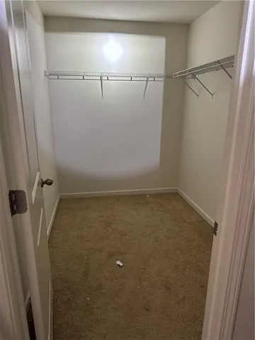 a view of a room with racks on the wall