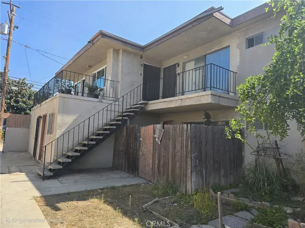 a front view of a house with wooden fence