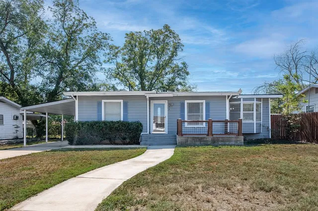 front view of a house with a yard