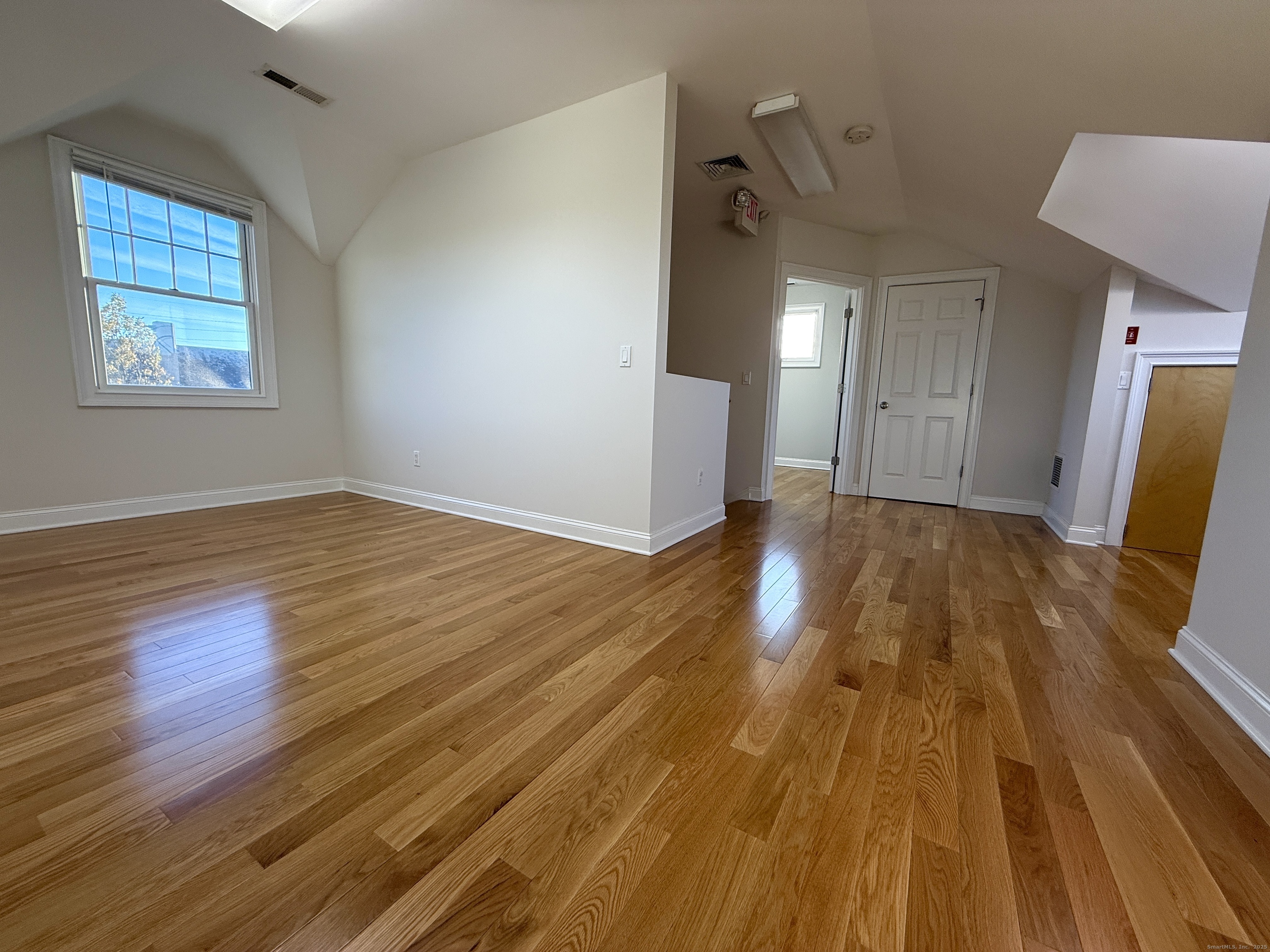 5 Myrtle Street Norwalk, CT 06855 - Photo 15 of 15 an empty room with wooden floor and windows