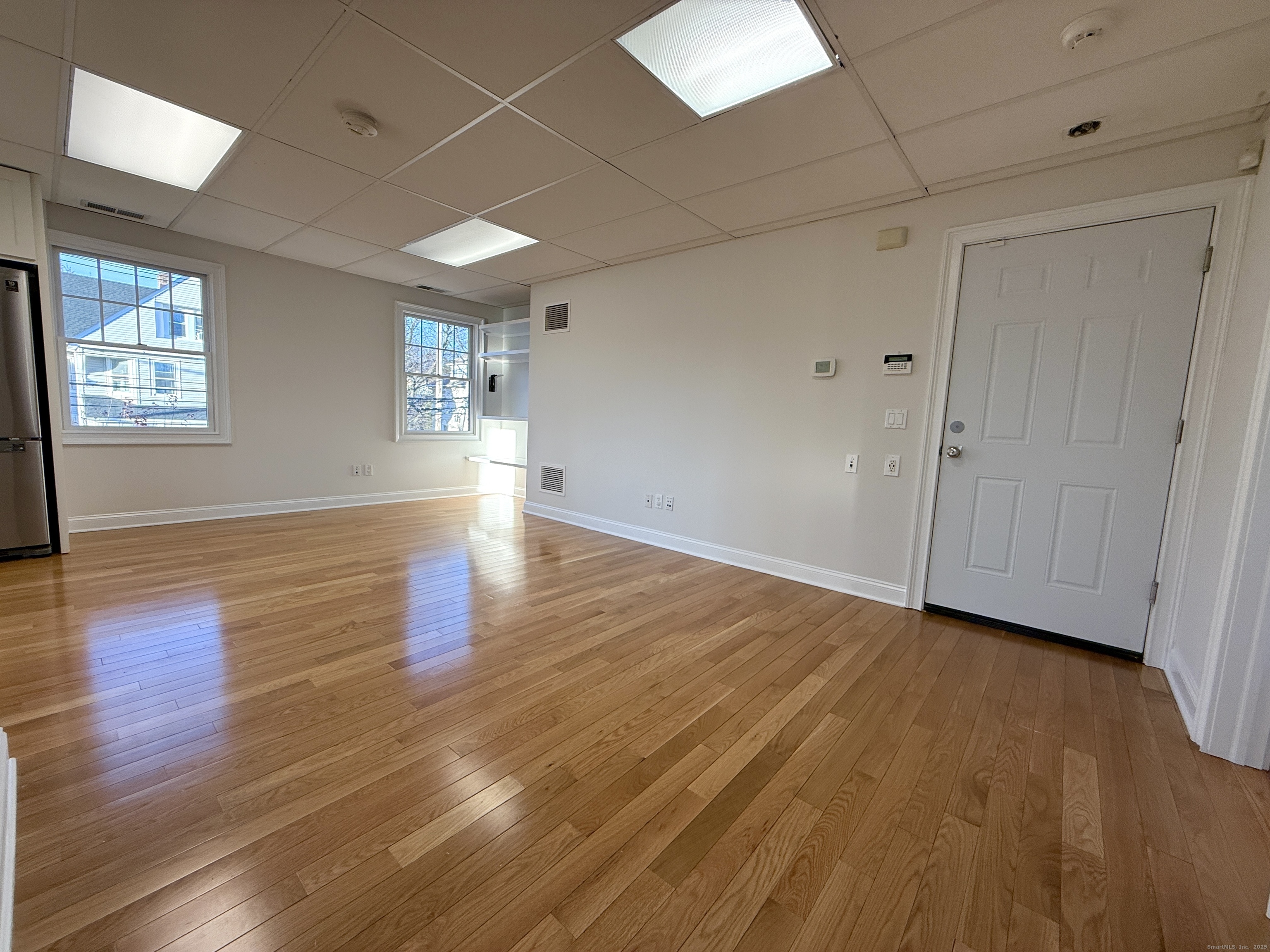 5 Myrtle Street Norwalk, CT 06855 - Photo 4 of 15 a view of empty room with wooden floor and fan