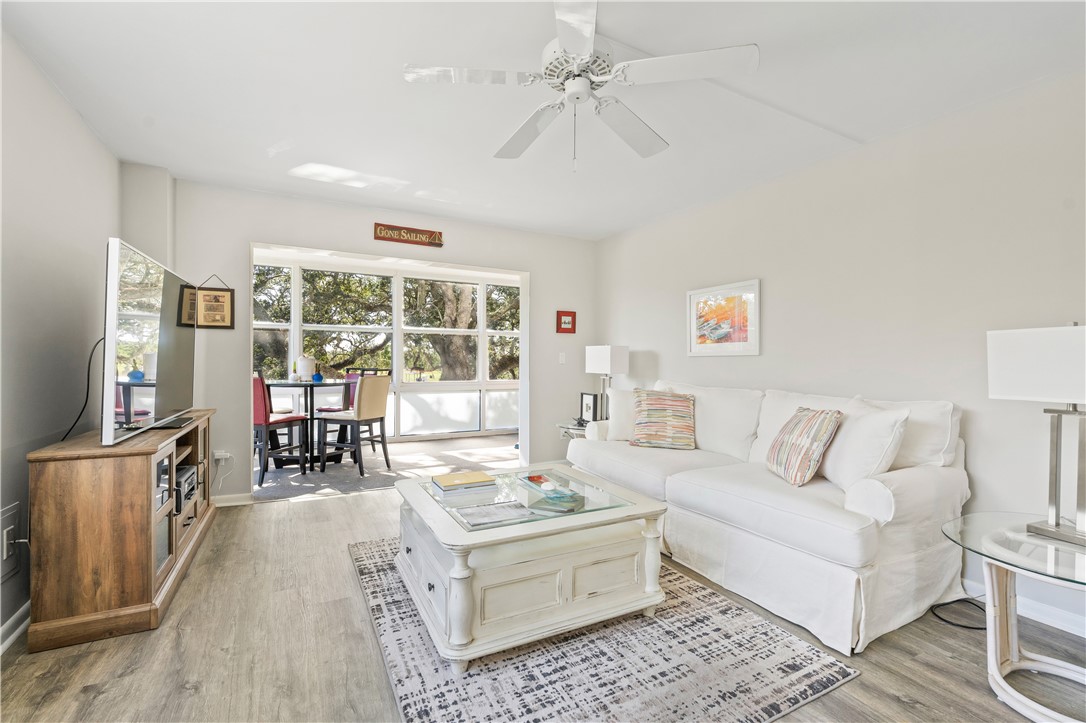 275 Date Palm Road, Unit 307 Vero Beach, FL 32963 - Photo 13 of 36 a living room with furniture and a flat screen tv