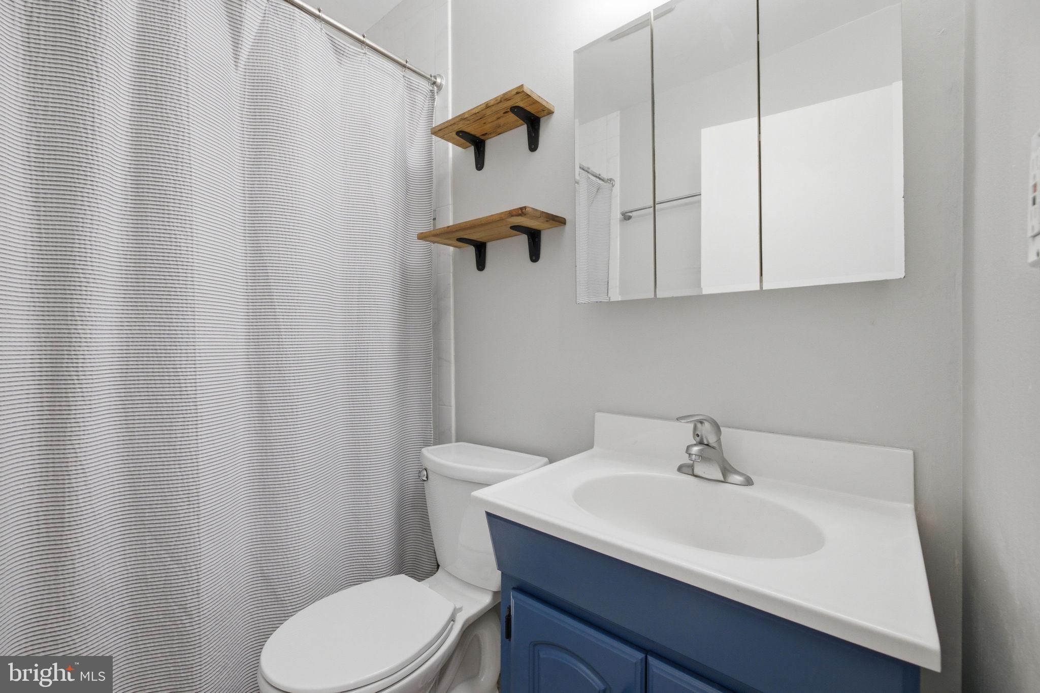 11937 Bayswater Road Gaithersburg, MD 20878 - Photo 23 of 55 Modern bathroom with sleek design.
