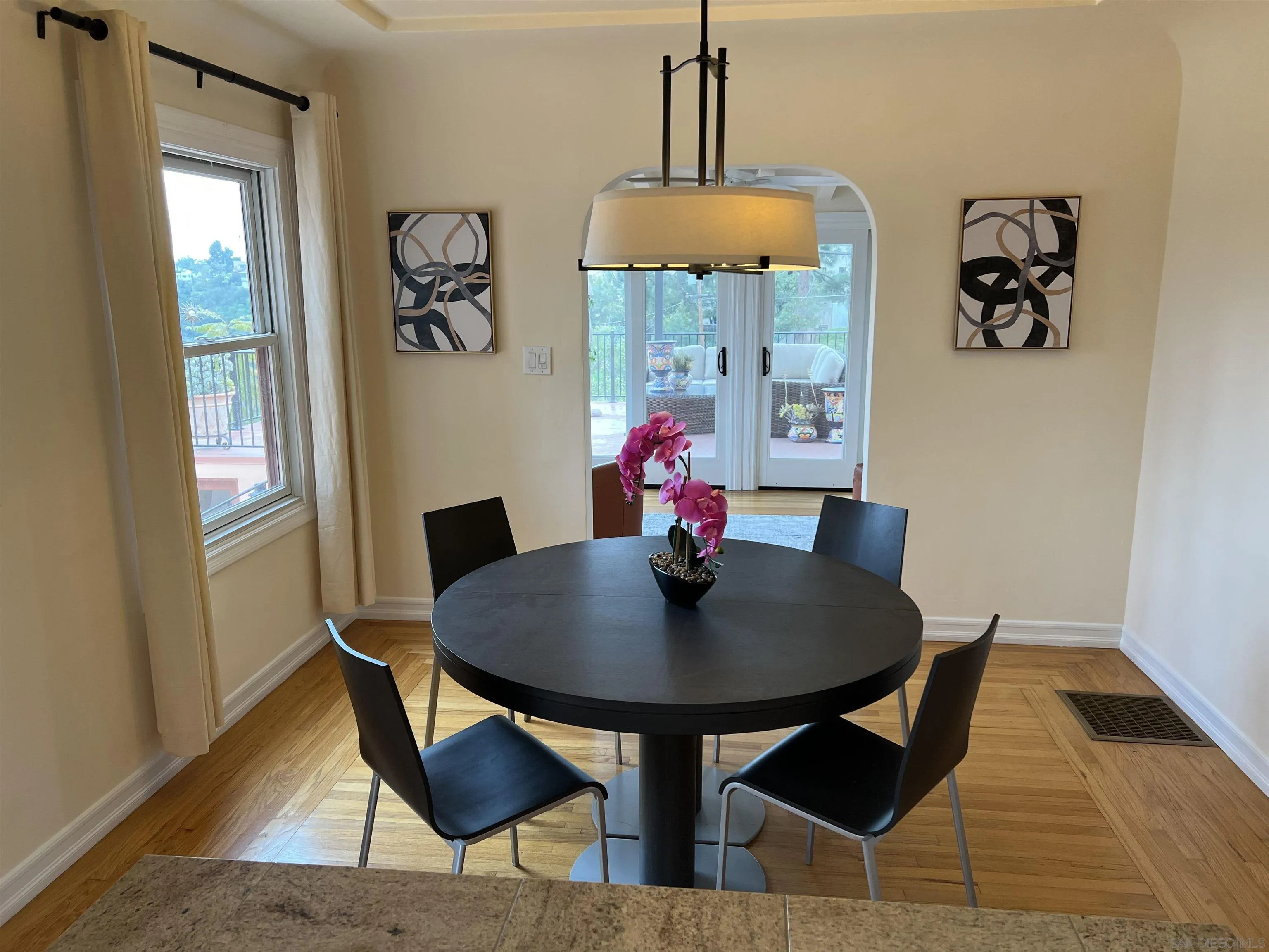 4196 Rochester Road San Diego, CA 92116 - Photo 11 of 72 a dining room with furniture and window