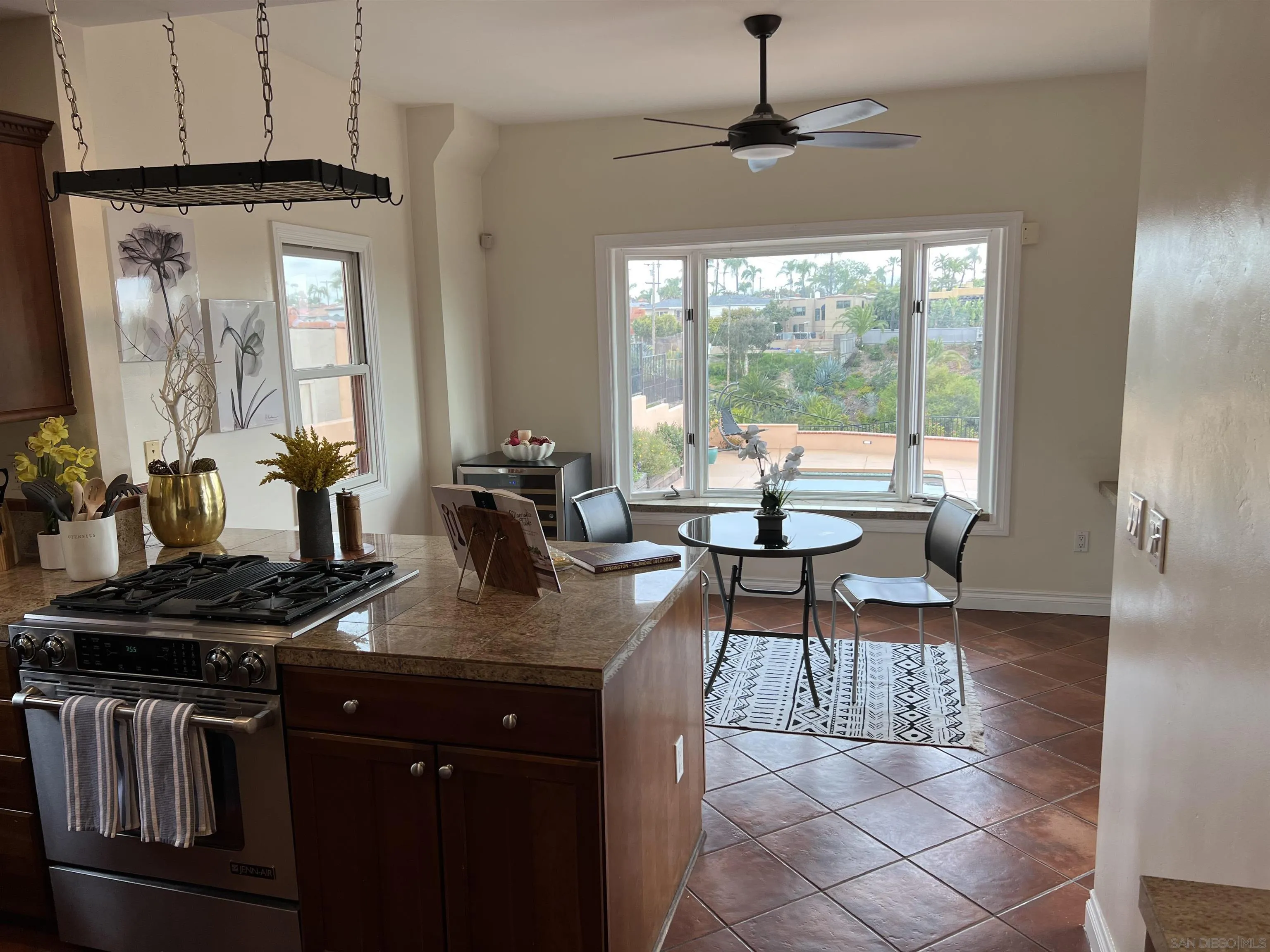 4196 Rochester Road San Diego, CA 92116 - Photo 13 of 72 a kitchen with stainless steel appliances granite countertop a stove a sink and a granite counter tops