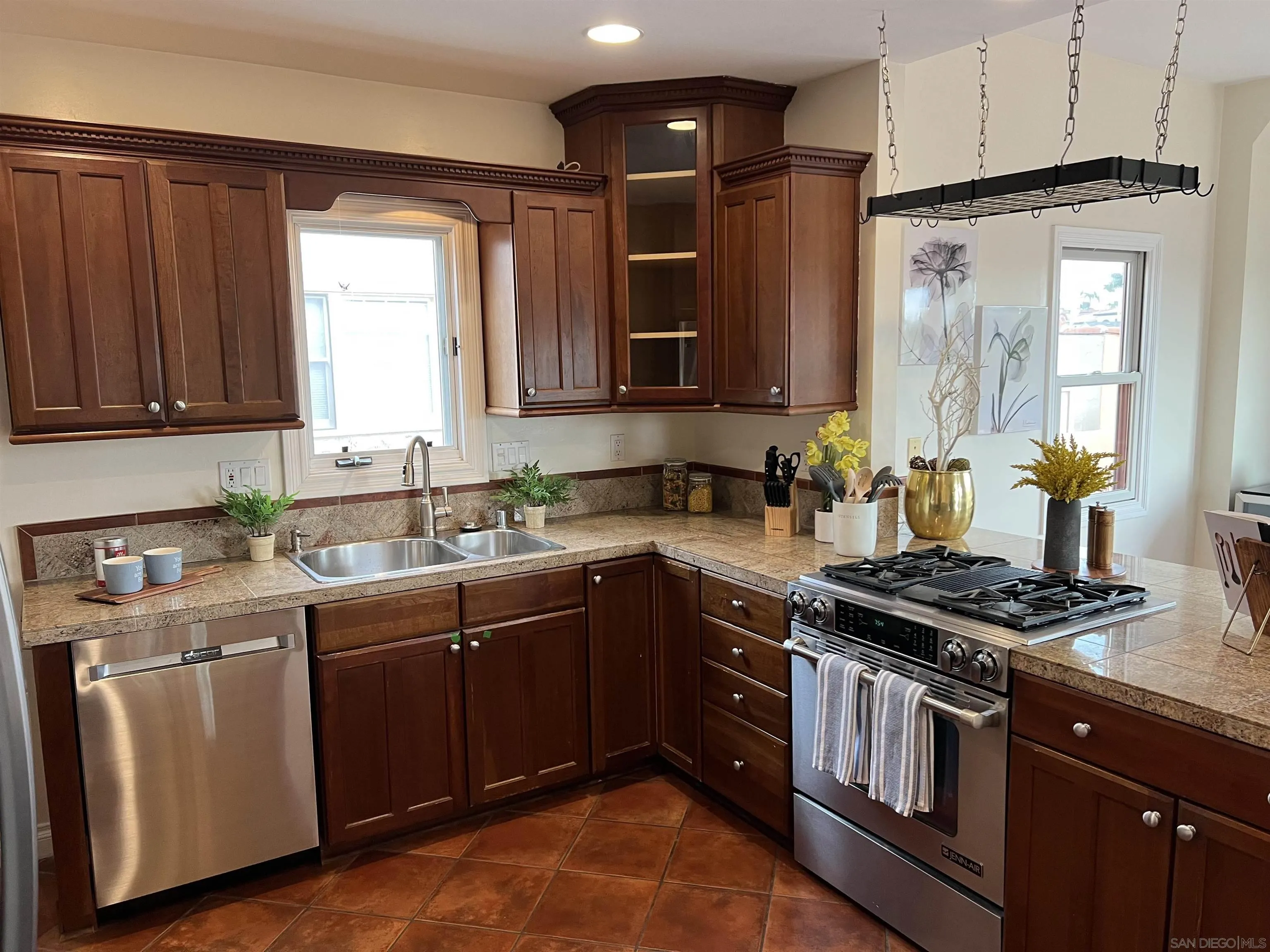 4196 Rochester Road San Diego, CA 92116 - Photo 15 of 72 a kitchen with stainless steel appliances granite countertop a stove a sink and a microwave