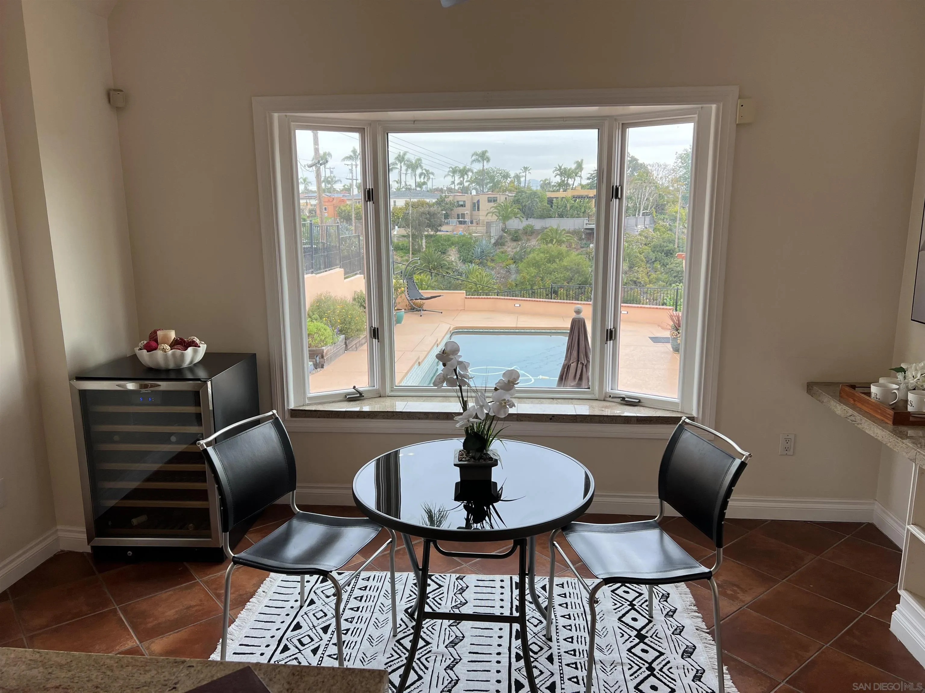 4196 Rochester Road San Diego, CA 92116 - Photo 17 of 72 a view of a dining room with furniture window and outside view