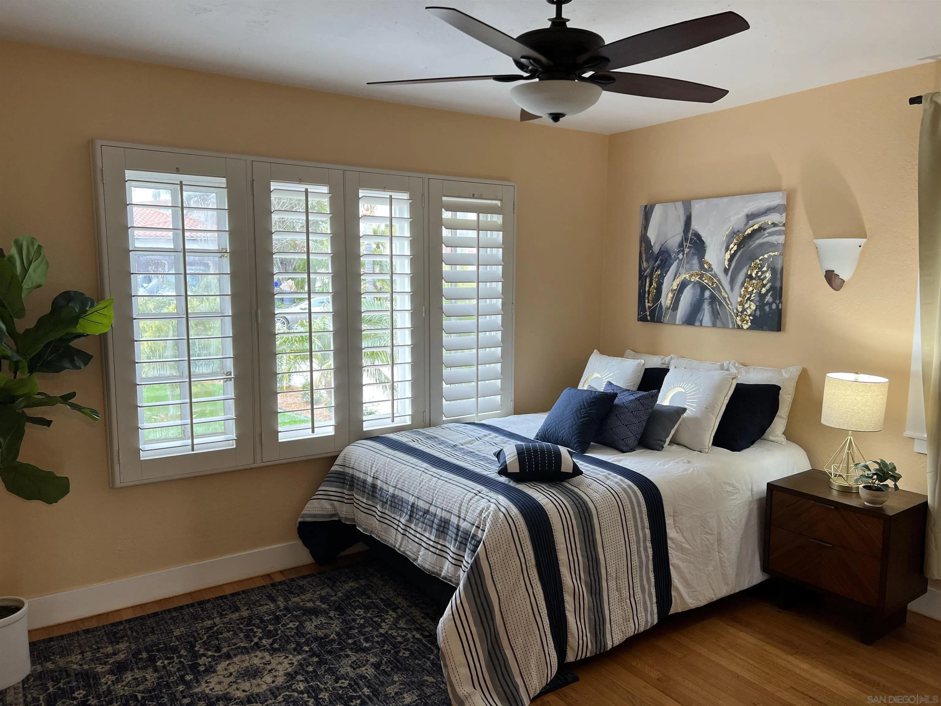 4196 Rochester Road San Diego, CA 92116 - Photo 21 of 72 a bedroom with a bed and a window