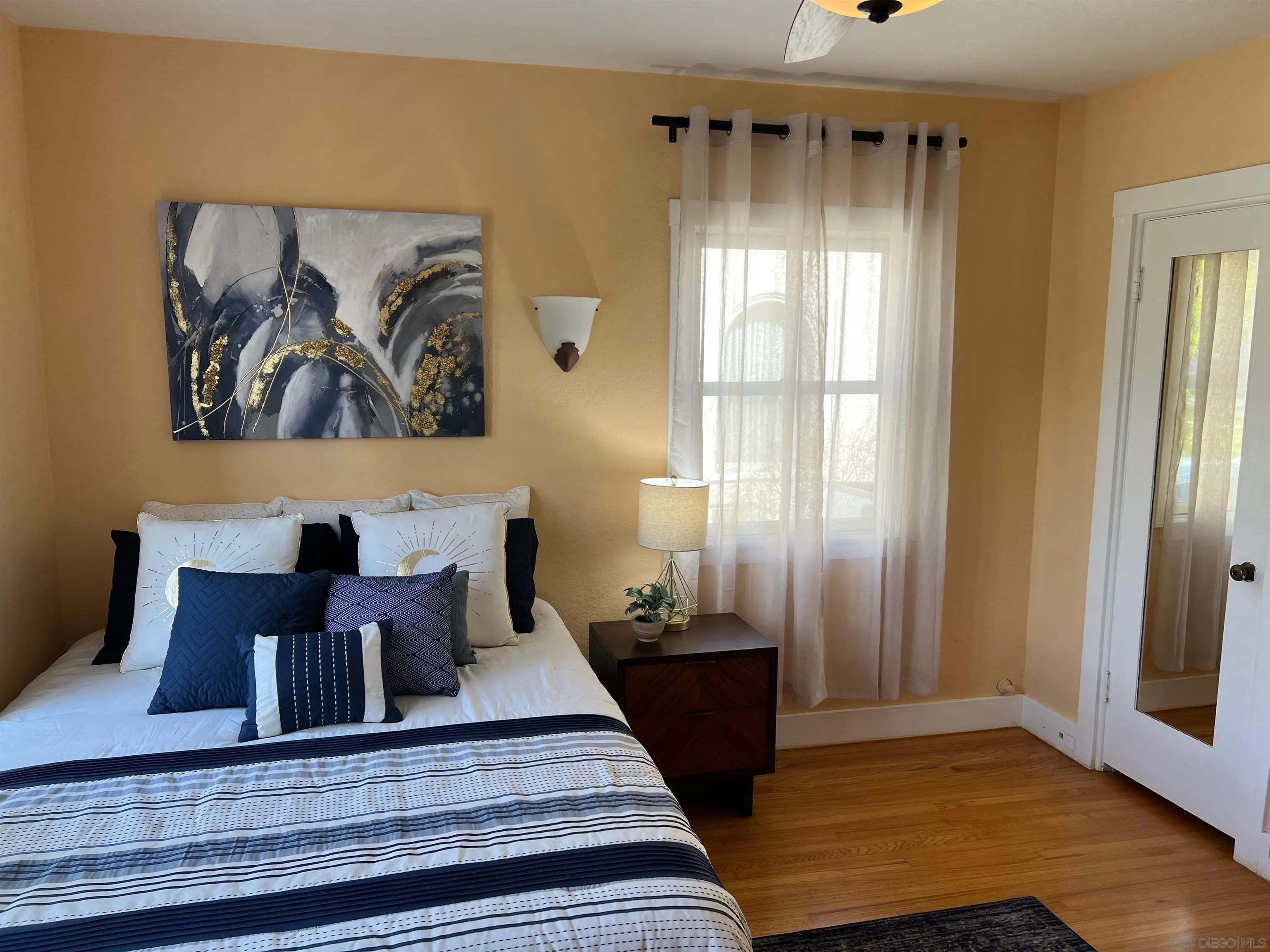 4196 Rochester Road San Diego, CA 92116 - Photo 23 of 72 a view of a balcony with furniture and wooden floor