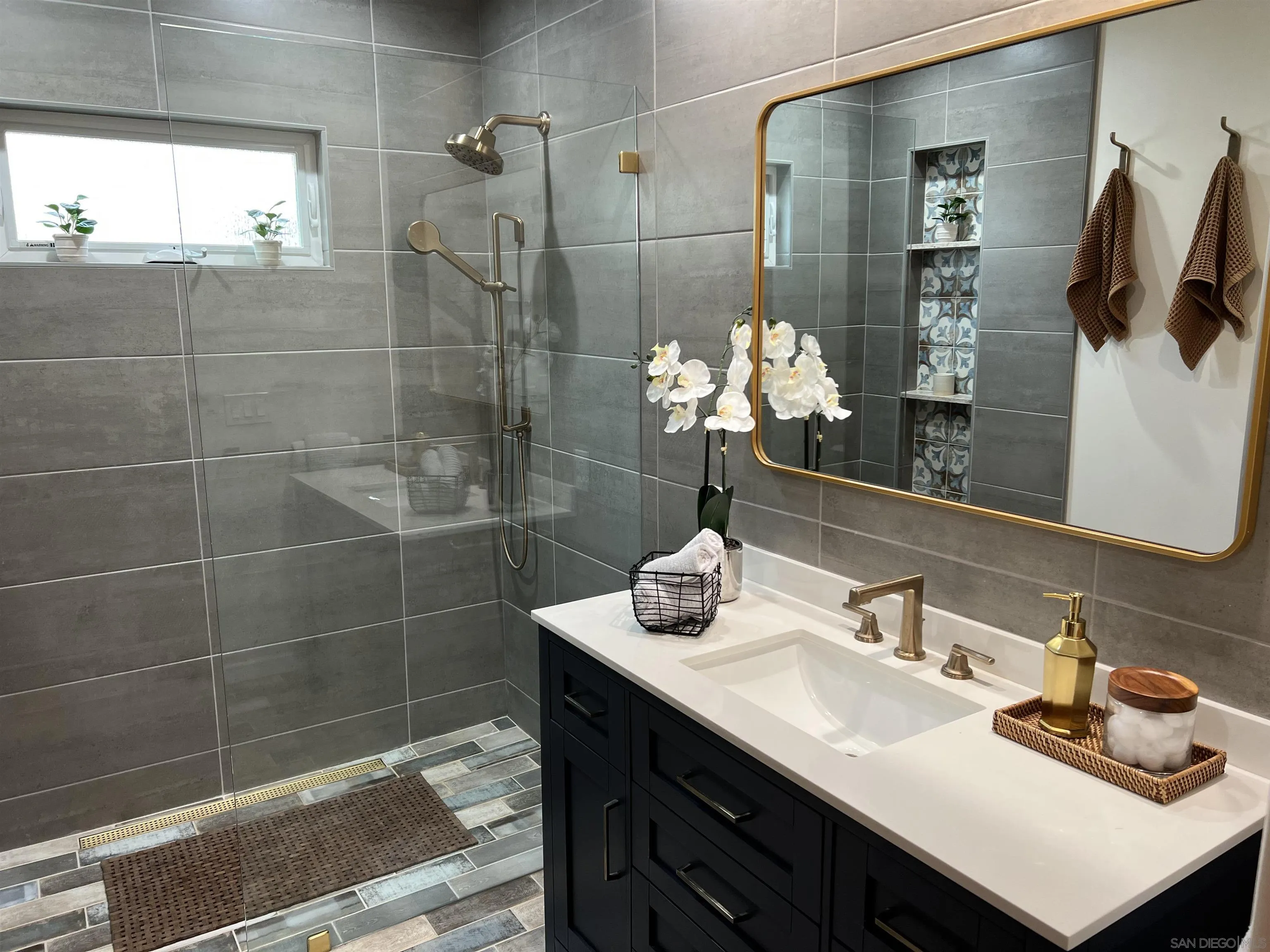 4196 Rochester Road San Diego, CA 92116 - Photo 24 of 72 a bathroom with a sink shower and a mirror