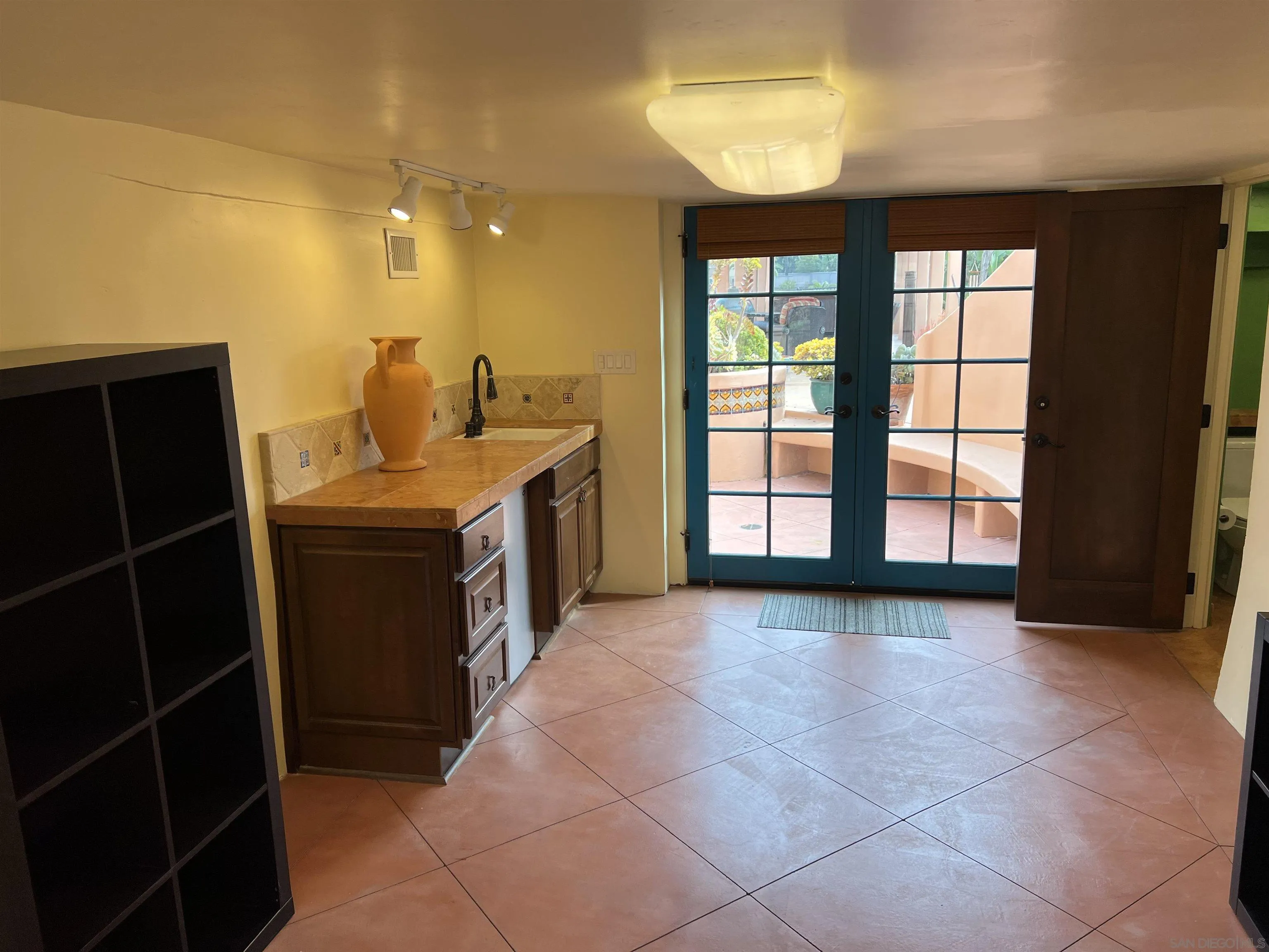 4196 Rochester Road San Diego, CA 92116 - Photo 31 of 72 a view of a kitchen with a sink and a window