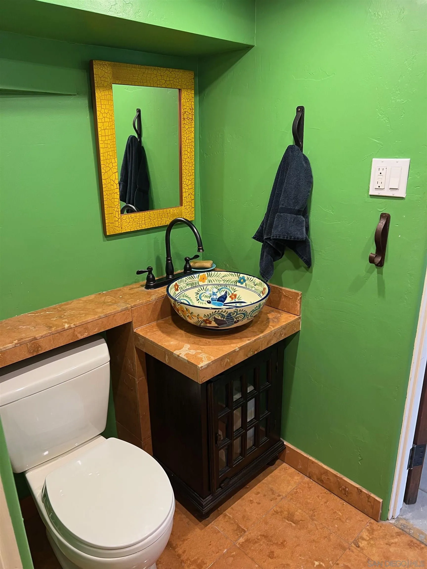 4196 Rochester Road San Diego, CA 92116 - Photo 34 of 72 a bathroom with a toilet sink and mirror