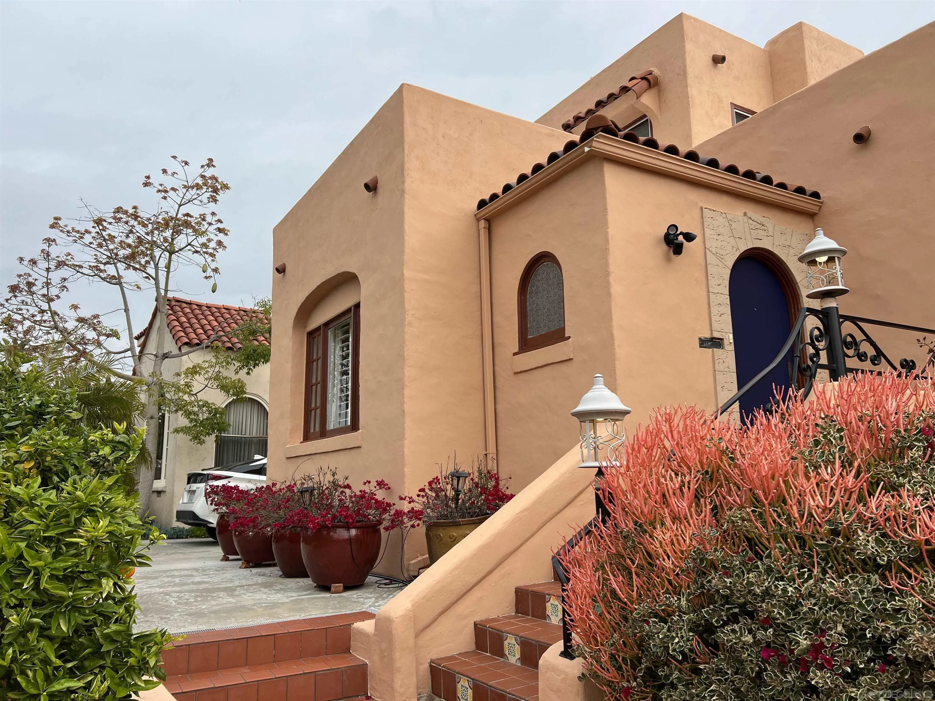 4196 Rochester Road San Diego, CA 92116 - Photo 4 of 72 a front view of a house with a yard