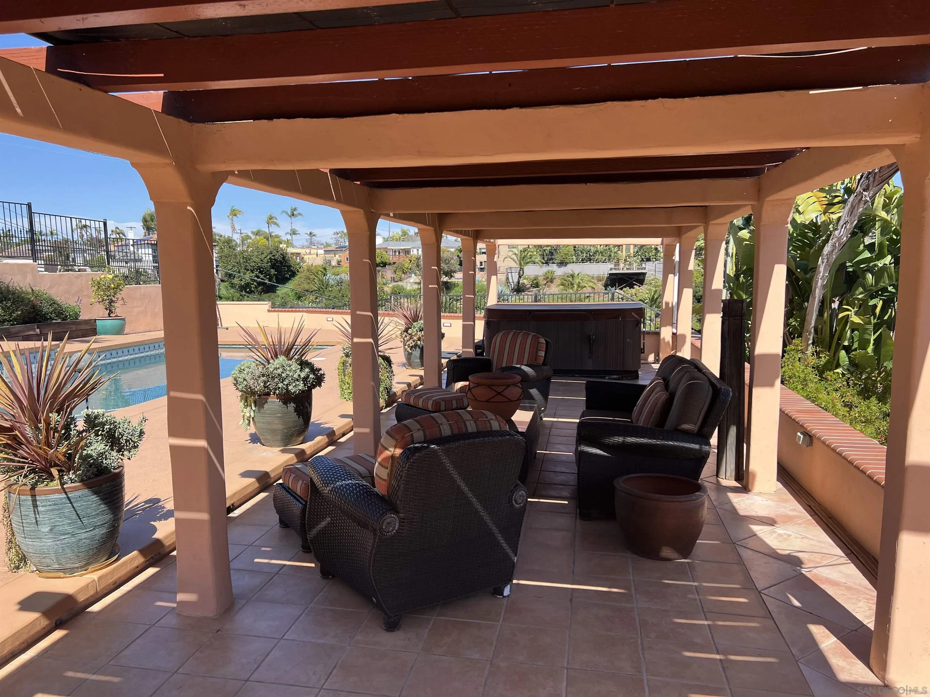 4196 Rochester Road San Diego, CA 92116 - Photo 54 of 72 a living room with patio furniture and a flat screen tv