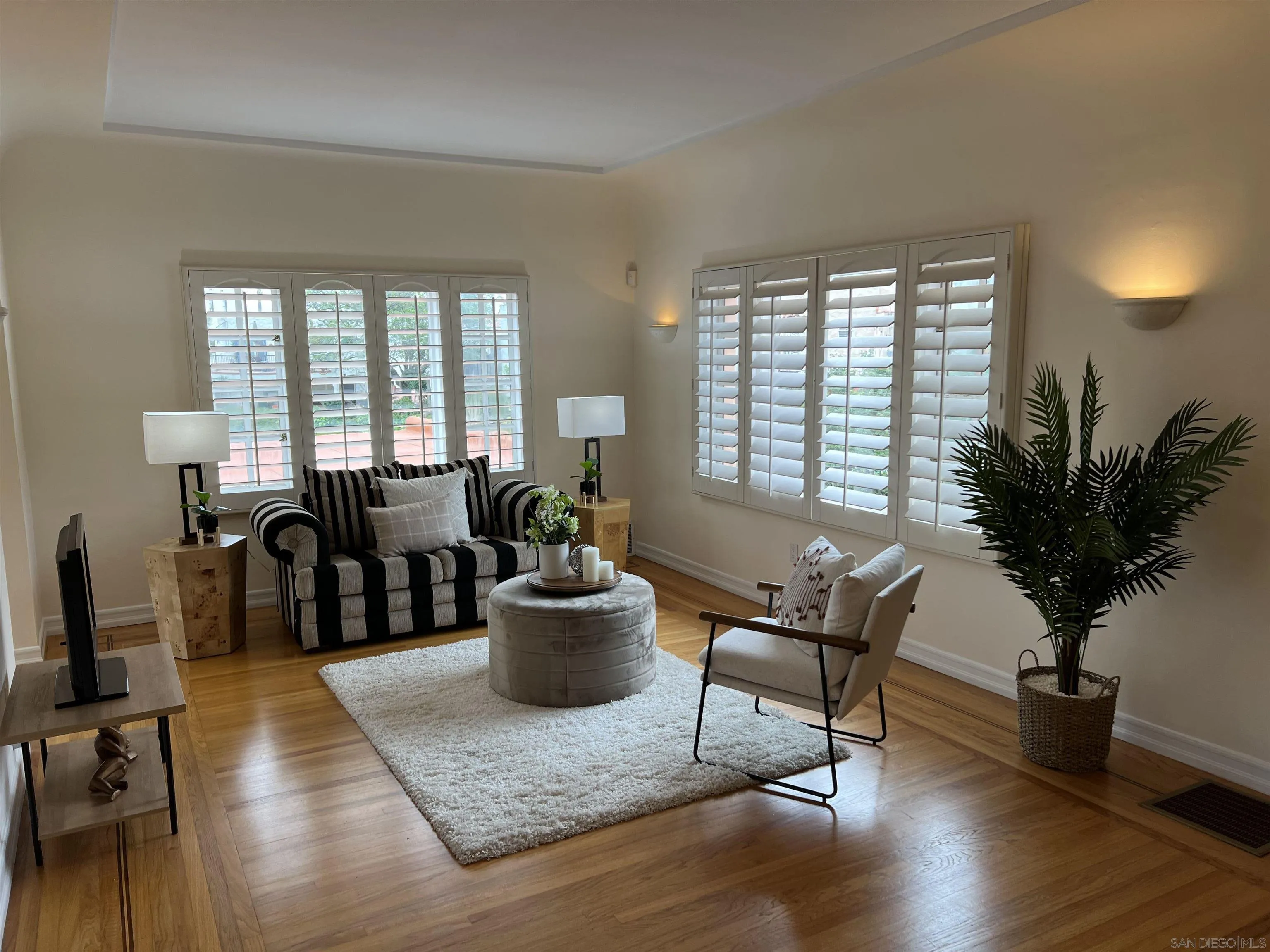 4196 Rochester Road San Diego, CA 92116 - Photo 7 of 72 a living room with furniture a window and a potted plant