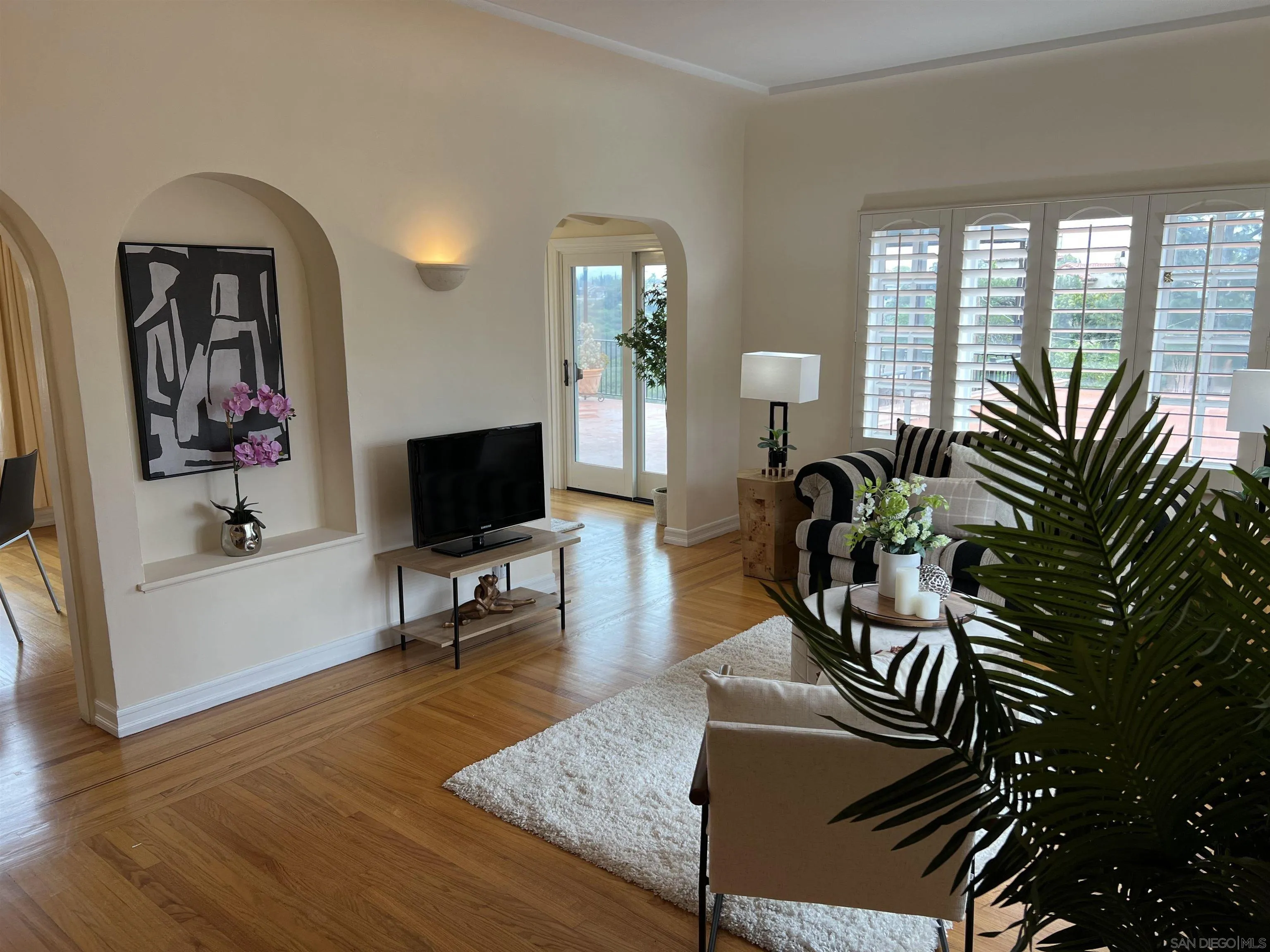 4196 Rochester Road San Diego, CA 92116 - Photo 8 of 72 a living room with furniture and a flat screen tv