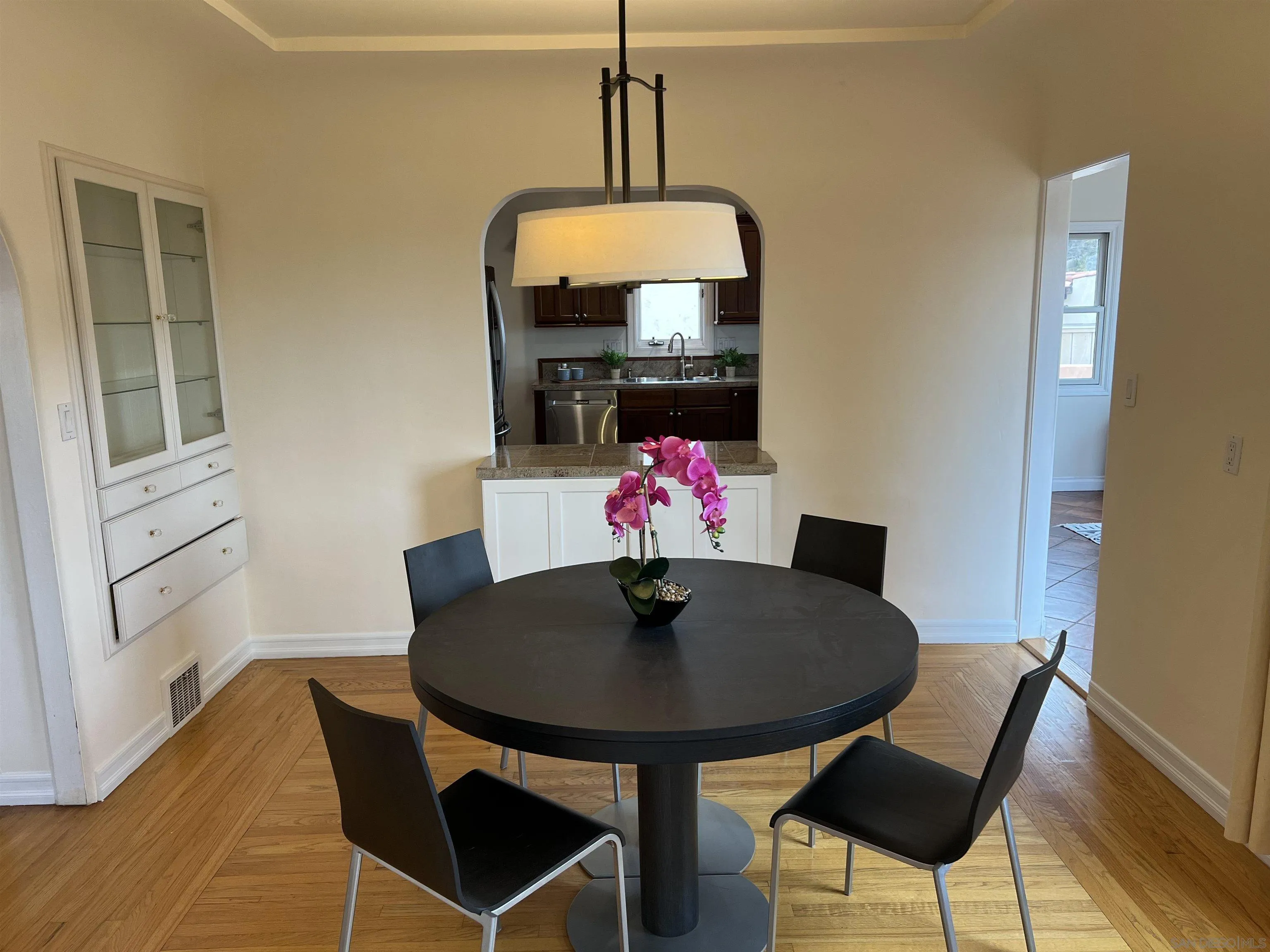 4196 Rochester Road San Diego, CA 92116 - Photo 10 of 72 a view of a dining room with furniture and wooden floor