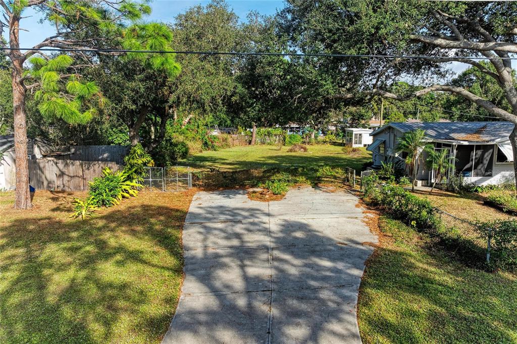 0 Park Road Venice, FL 34293 - Photo 6 of 24 a view of a yard with plants and large trees