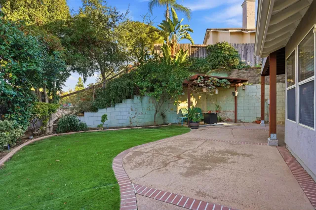 a sign board with yard in front of it