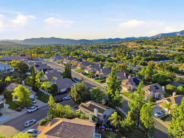 a view of a city with mountains in the background