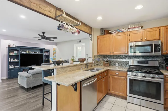 a kitchen with a stove and a microwave