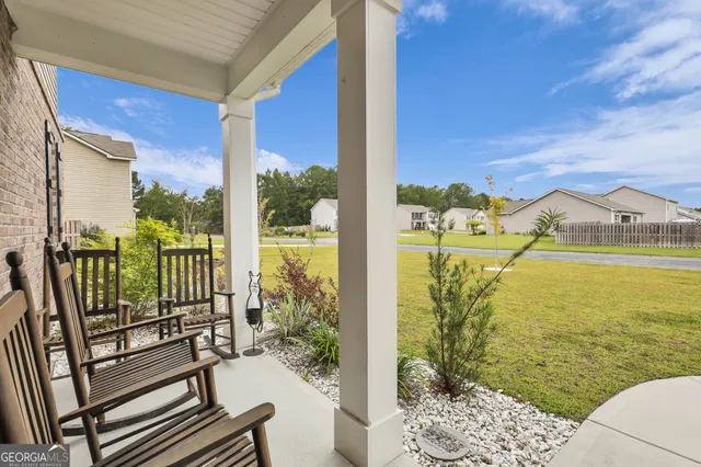a view of a swimming pool with chairs